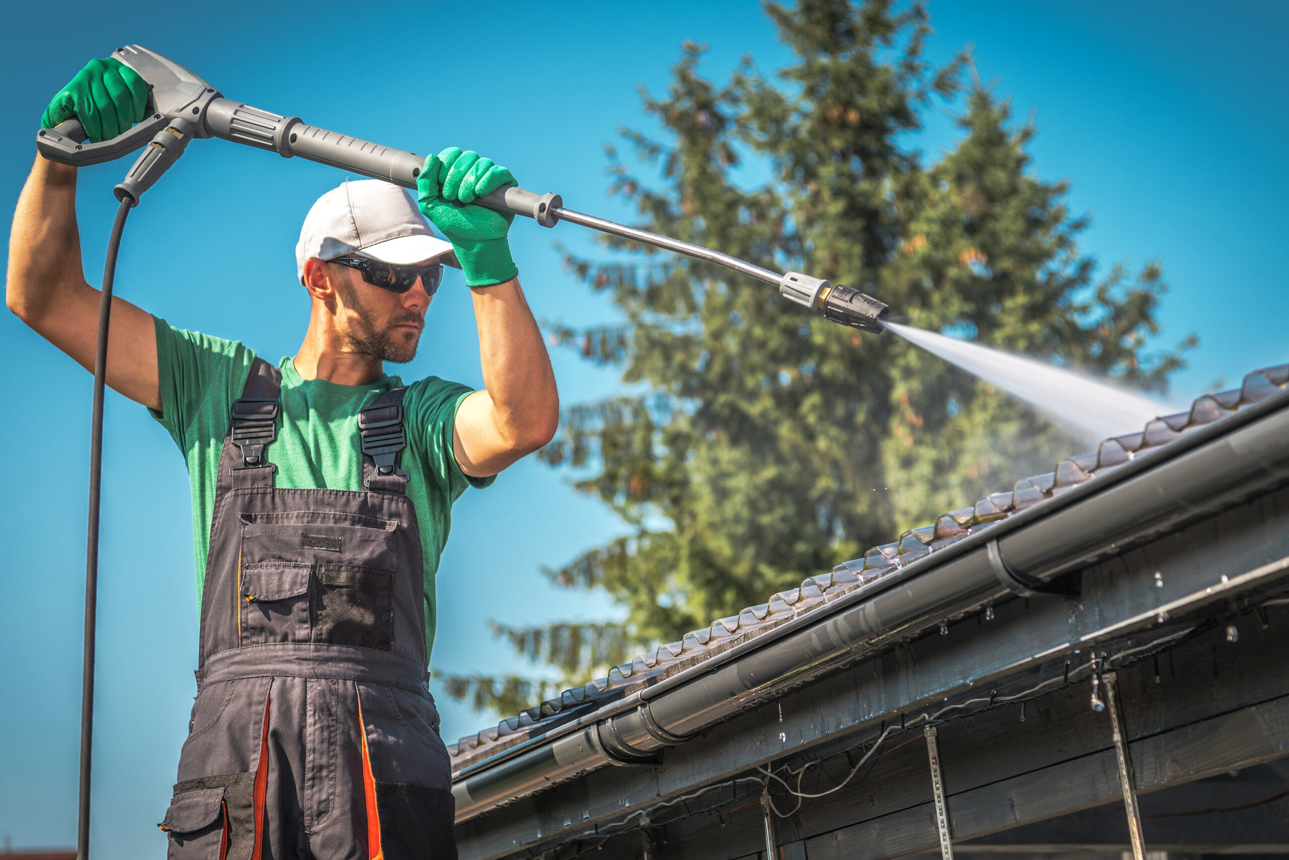 Washing Plastic Carport Roof:rain gutter, cleaning, wash, pressure washer, spraying, water, spring cleaning, roof, roofing, household, closeup, powerful, wood, architecture, object, horizontal, caucasian, worker, job