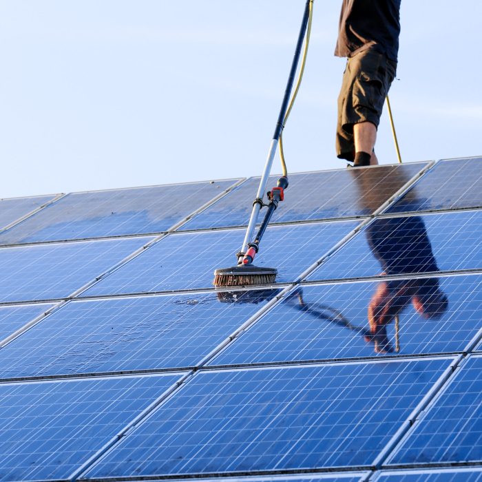 Cleaning,Solar,Panels,With,Brush,And,Water